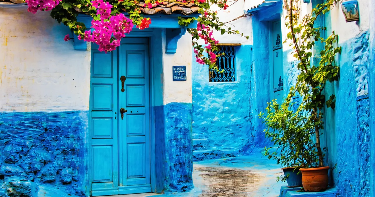 Blue-painted streets of Chefchaouen Morocco at golden hour