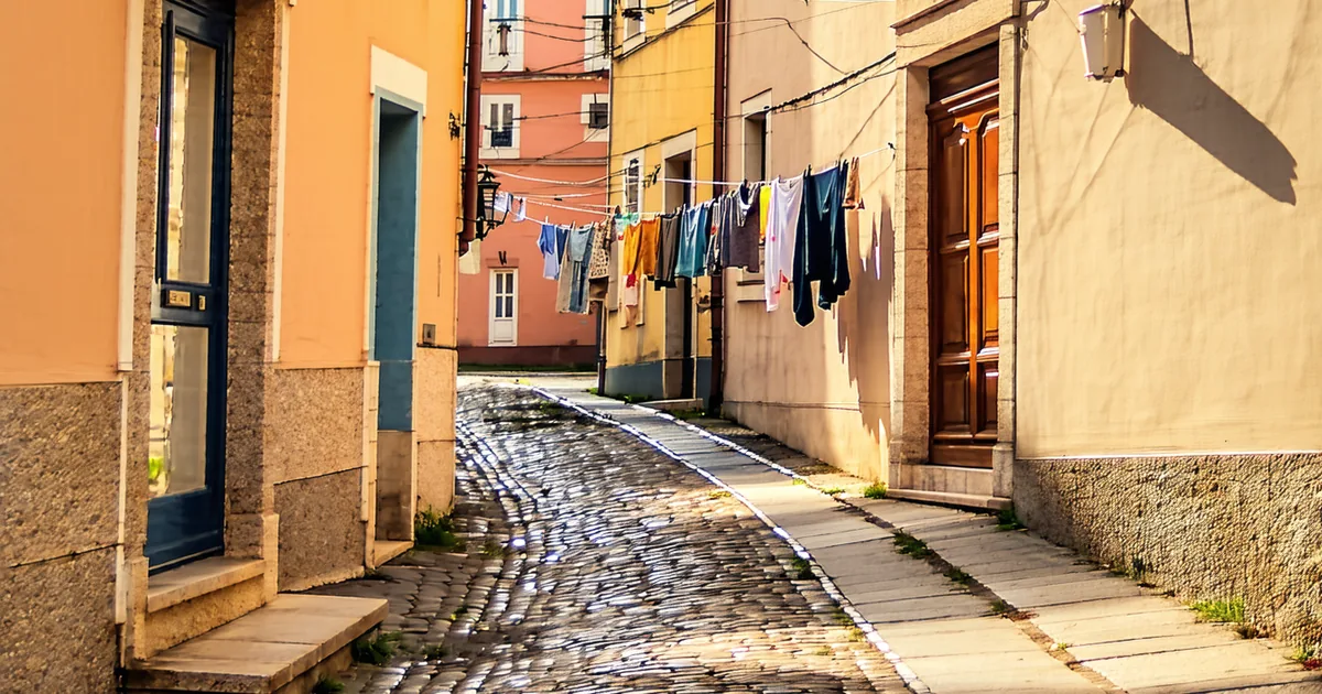 Empty morning street in European neighborhood, golden light, no tourists